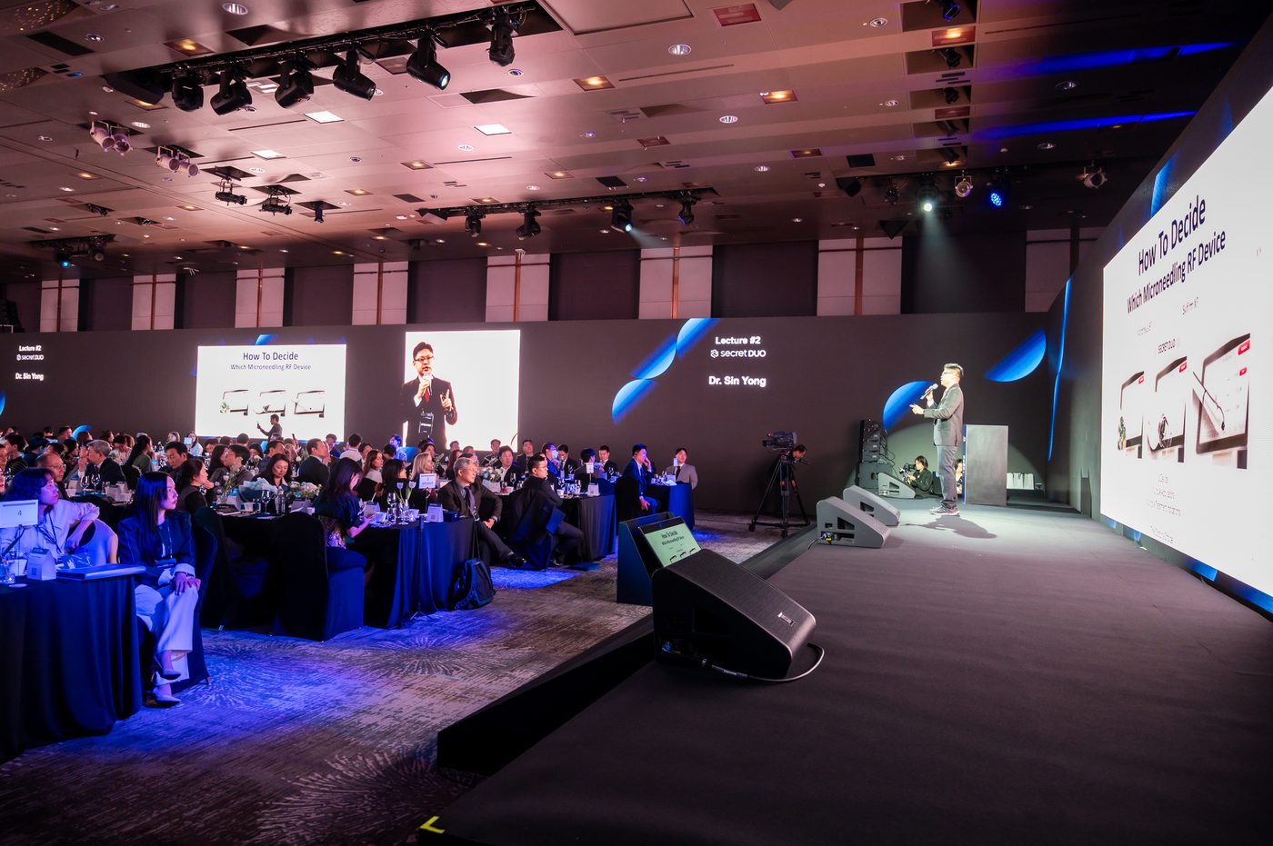 Dr Sin Yong on stage with host at the CLASSYS Global Customer Summit in Seoul 2025